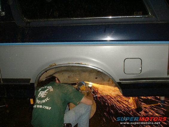 15.2-megrinding2.jpg Here I'm grinding out the old broken bump stops. One was broke off and the other kept spinning...just ground off the bolt and knocked it out.