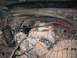1994 Ford Bronco - Close-up view of an engine's intake manifold with instructional arrows and text.