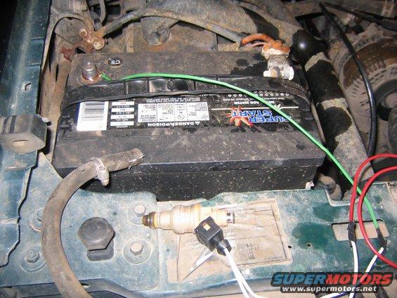 Fuel injector and battery in engine bay