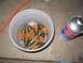 1994 Ford Bronco - Fuel injectors are soaking in a cleaning solution next to a can of automotive cleaner.