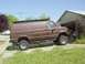 1982 Ford F-250 - This van has a raised suspension and a roof rack, suggesting it's built for off-road use.