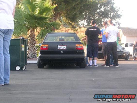 Black Volkswagen Jetta GLI with license plate 4WDL294 parked outdoors