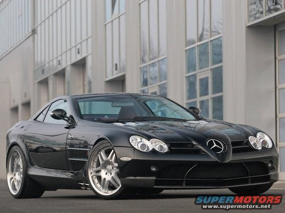 Black Mercedes-Benz SLR McLaren parked in front of a modern building