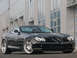 1990 Ford Bronco - A black Mercedes-Benz SLR McLaren is shown from a three-quarter front view.