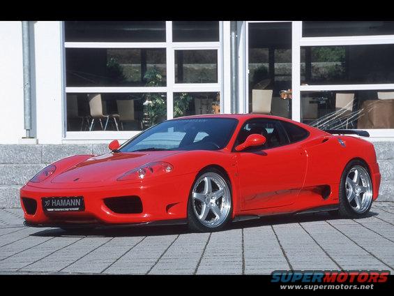 Red sports car with Hamann badging on the front bumper