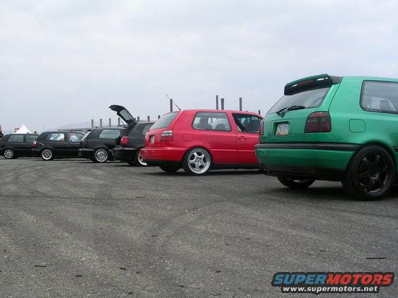 Green Volkswagen Golf Mk3 hatchback with a rear spoiler and black wheels