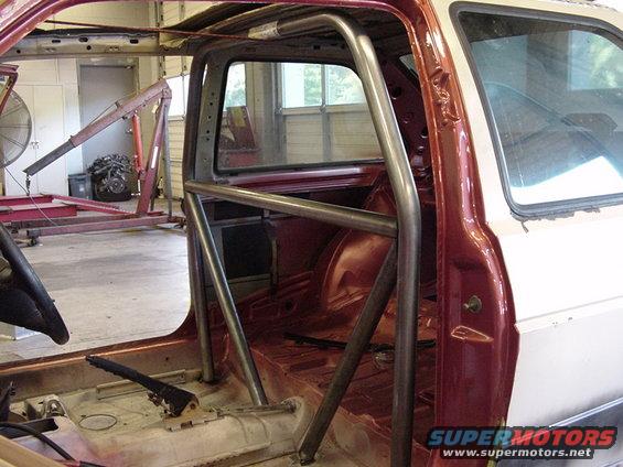 Interior of a car with a roll cage and stripped-down interior