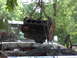 1978 Ford Bronco - An engine is being removed from a white vehicle, with chains holding it aloft.