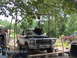 1978 Ford Bronco - A 1978 Ford Bronco is parked outdoors with its engine being hoisted out for maintenance or repair.