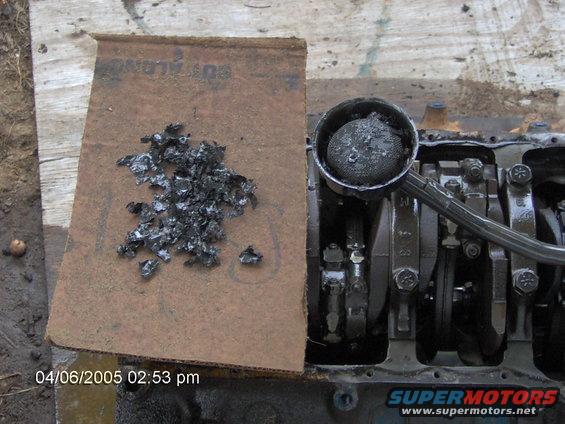 Engine block with debris and oil filter. Date stamp 04/06/2005