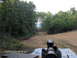 1978 Ford Bronco - A view down a shooting range with targets at various distances, framed by trees.