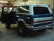 1978 Ford Bronco - This Ford Bronco is parked inside a garage with its driver's door ajar.