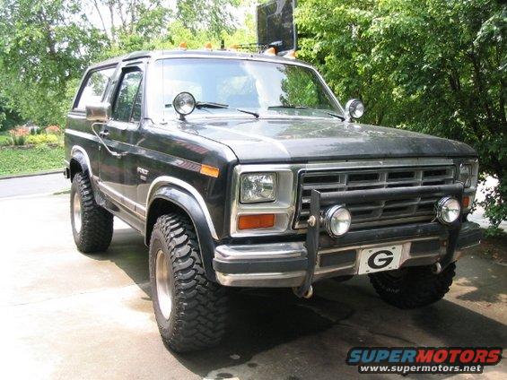 Black Ford Bronco, 3/4 front view, with off-road tires and aftermarket bumper