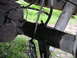 1994 Ford Bronco - A close-up view of a vehicle's rear axle assembly, showing brake lines and a tool attached.
