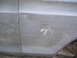 1979 Ford Bronco - This vehicle body panel has significant damage, including scratches and a large white mark.