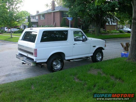 img12.jpg Next  is a 4" lift with super runner steering, 
35 x 12.50 tires, 456 gears, ARB air locker in the rear, and a Warn  winch & bumper set.