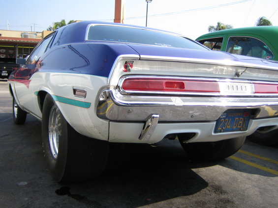 Rear view of a blue and white 1970 Dodge Challenger with drag tires and a California license plate
