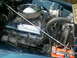 1956 Ford F-100 - Close-up of a Ford V8 engine, showing valve covers and air intake system.