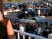 1986 Ford F-250 - A heavily modified Ford Bronco navigates a challenging obstacle course in front of a crowd.