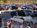 1986 Ford F-250 - A crowd watches as an off-road vehicle is positioned on large concrete pipes.