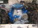 1985 Ford Crown Victoria LTD - The engine bay shows a blue V8 engine with a large air filter and various wires and components.