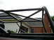 1995 Ford Bronco - Close-up view of a custom roll cage structure against a residential background.