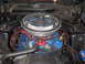 1972 Ford Mustang - Close-up view of a Ford V8 engine, a chrome air cleaner and prominent red spark plug wires.