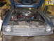1972 Ford Mustang - The front of a blue 1971 Ford Mustang is visible with its hood open, revealing the engine bay.
