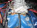 1972 Ford Mustang - Close-up view of an engine's carburetor and intake manifold with visible wiring.