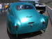 1972 Ford Mustang - Rear view of a custom teal coupe, possibly a Henry J, at an outdoor event.
