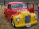 1972 Ford Mustang - This customized pickup truck features a two-tone paint scheme with flame graphics and an open door.