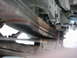 1978 Ford Bronco - Close-up of vehicle leaf springs and suspension parts, no year visible.