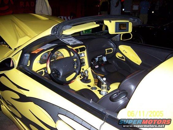 Yellow convertible interior with custom flames and a date stamp of 06/11/2005