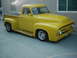 1978 Ford Bronco - A bright yellow 1953 Ford F-100 pickup truck is parked on a concrete surface.