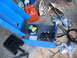 1988 Ford Bronco - A blue welding machine is shown with its wire spool, a welding mask, and a red gas can, along with other accessories scattered items.