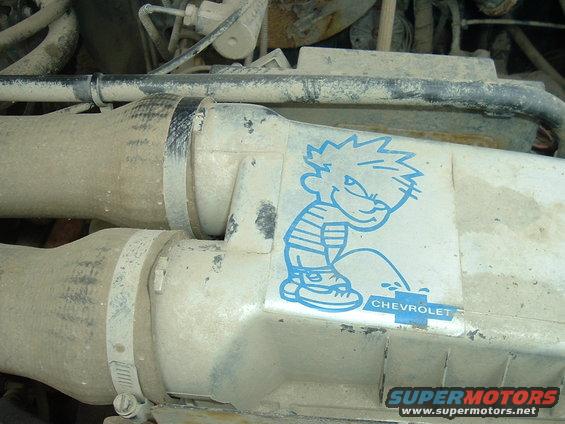 Engine bay with Calvin peeing on Chevrolet logo sticker