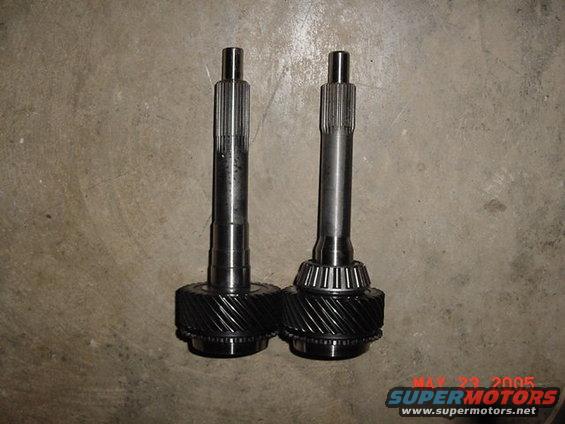 Two transmission input shafts with gears, one with a conical bearing
