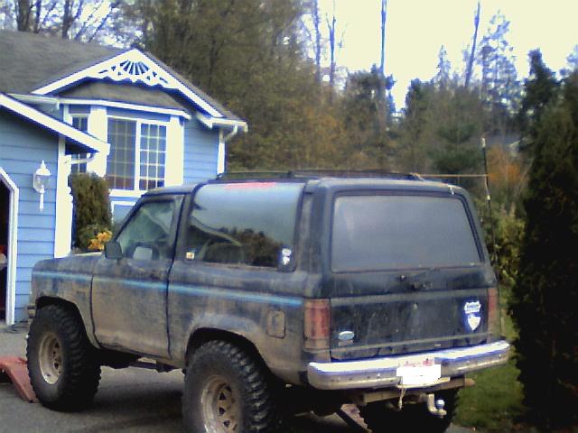 1987 Ford Bronco II, rear view, dirty, parked in driveway