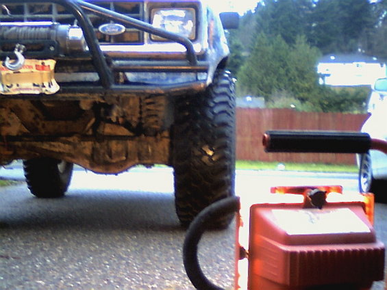 Front of a lifted 1987 Ford Bronco II with a winch and brush guard