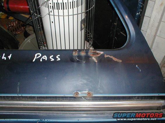 Blue door panel with rust and handwritten text 'Right Pass'
