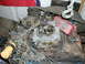 1979 Ford Bronco - Engine components including a carburetor and an MSD ignition box are shown, held by chains.