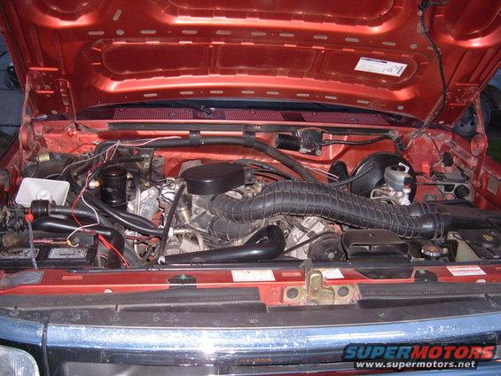 Engine bay of a 1994 Ford Bronco with hood open