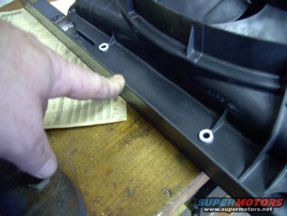 img_0030.jpg I started with these two stock taurus shroud holes, which look like they're lined up straight one on top of the other, but they're not. I marked, drilled and tapped and installed one stud, before marking the other hole.