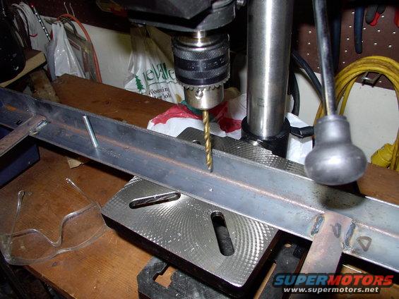 img_0032.jpg Here I am drilling the second hole on my new mini-bench drill press. How can they make these for $30 ?!