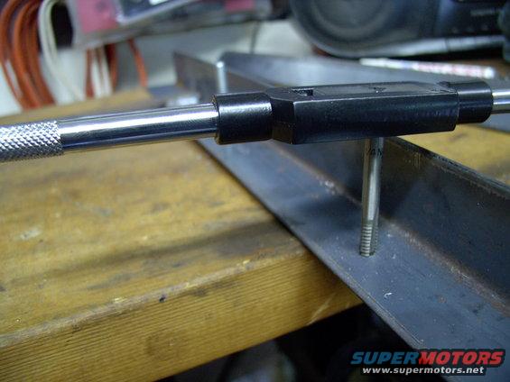 img_0035.jpg Now it's just a matter of tapping them for the stud, with the 1/4"-UNC-20 tap.