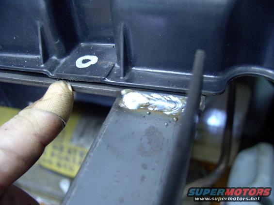 img_0026.jpg There are only three stock holes in the taurus shroud, but this flat surface on the lower edge of the shroud was the perfect spot for a 4th and final corner securing point.