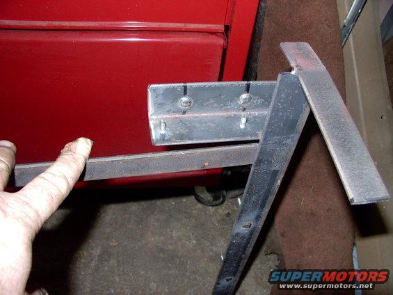 img_0068.jpg Here you can see the strap steel that fits flat to the top of the rad support. 2 screws is all it will take to secure or remove the whole assembly thanks to the alignment slots in the lower rad support. Note a couple of the welds that secure the studs.