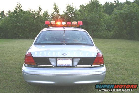 1998 Ford Crown Victoria rear view with "RESCUE SQUAD" text and light bar