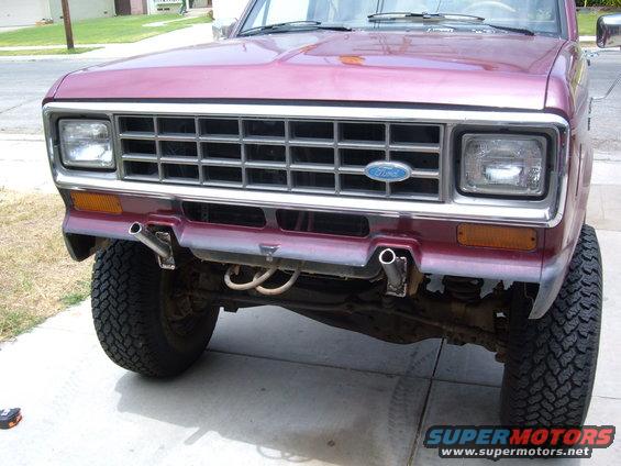Maroon 1985 Ford Bronco II front grille and bumper, with visible Ford logo