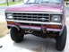 1985 Ford Bronco II - Front view of a maroon 1985 Ford Bronco II, showing its grille and headlights.